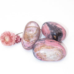Strawberry Opal crystal palm stone held in hand
