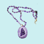 Amethyst jewelry set against natural stone background — crystal jewelry gift set for healing and wellness by Crystalvana
