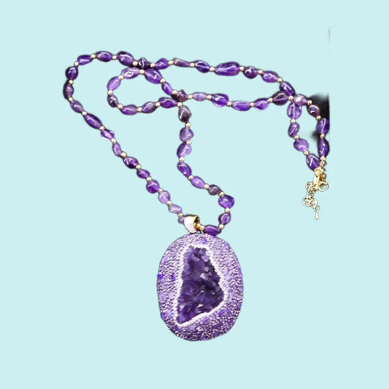 Amethyst jewelry set against natural stone background — crystal jewelry gift set for healing and wellness by Crystalvana