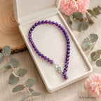 12mm Amethyst necklace on table display - purple crystal jewelry by Crystalvana