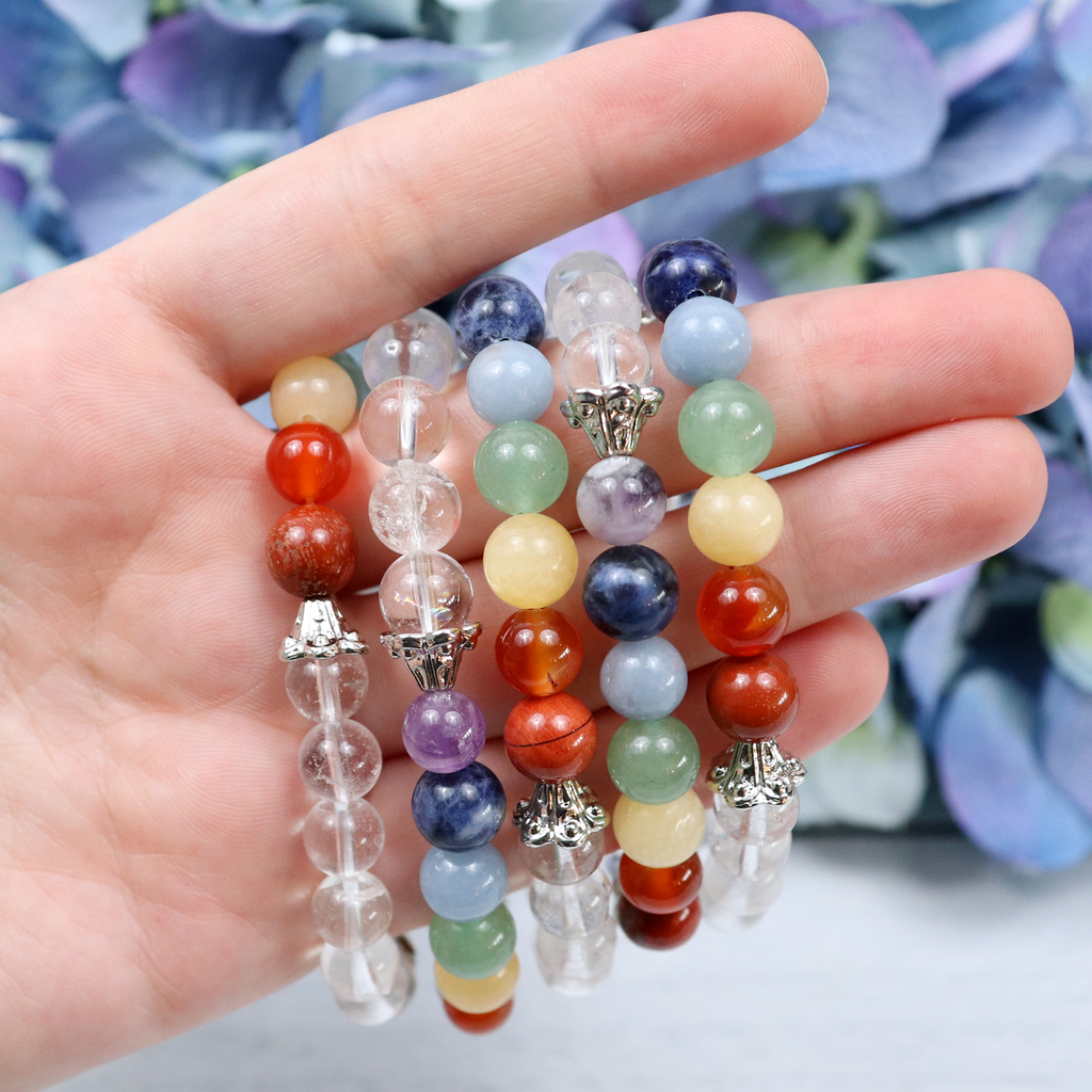Seven Stones crystal bracelet stacked with other Crystalvana pieces