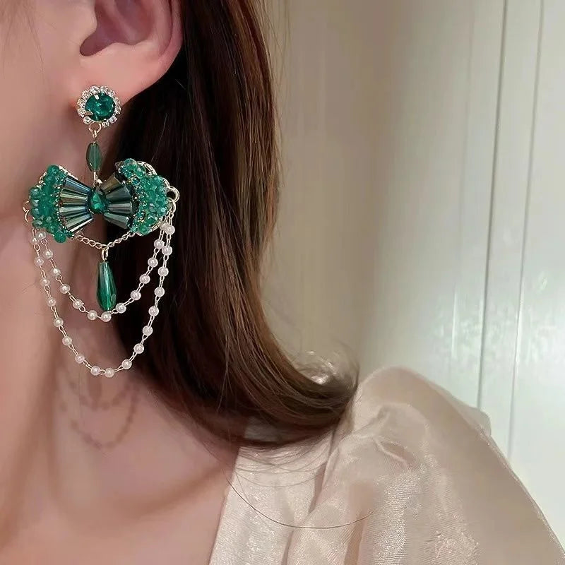 Pearl earrings on display with natural lighting — natural crystal earrings for healing and wellness by Crystalvana