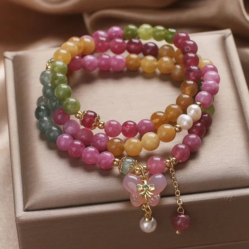 Detail texture of tourmaline natural stone surface — healing crystal bracelet for positive energy by Crystalvana