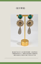 Crystal Flower earrings styled on model wrist — natural crystal earrings for positive energy by Crystalvana