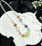Overhead flat lay of citrine necklace — handcrafted crystal necklace for positive energy by Crystalvana