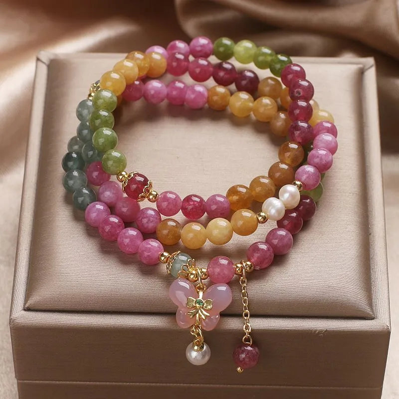 Overhead flat lay of tourmaline bracelet — healing crystal bracelet for positive energy by Crystalvana