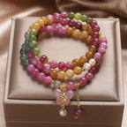Overhead flat lay of tourmaline bracelet — healing crystal bracelet for positive energy by Crystalvana