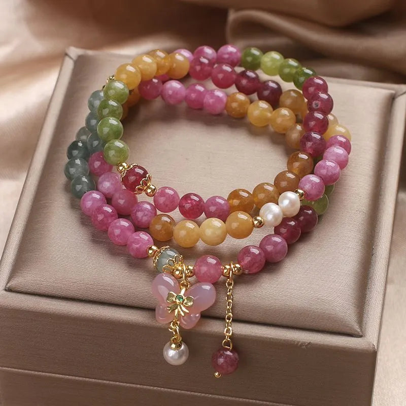 Tourmaline bracelet against natural stone background — healing crystal bracelet for positive energy by Crystalvana