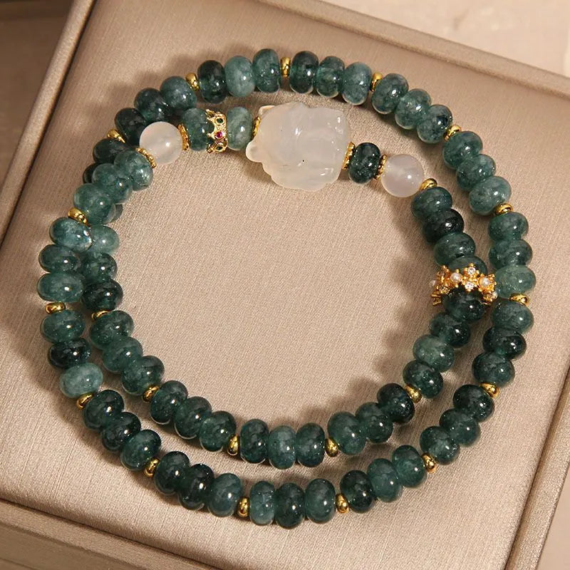 Overhead flat lay of blue chalcedony bracelet — healing crystal bracelet for positive energy by Crystalvana