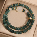 Overhead flat lay of blue chalcedony bracelet — healing crystal bracelet for positive energy by Crystalvana