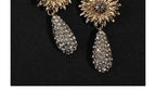Macro close-up of crystal flower earrings craftsmanship — natural crystal earrings for positive energy by Crystalvana