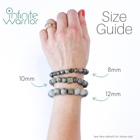 Turquoise bracelet with silver rings worn on wrist