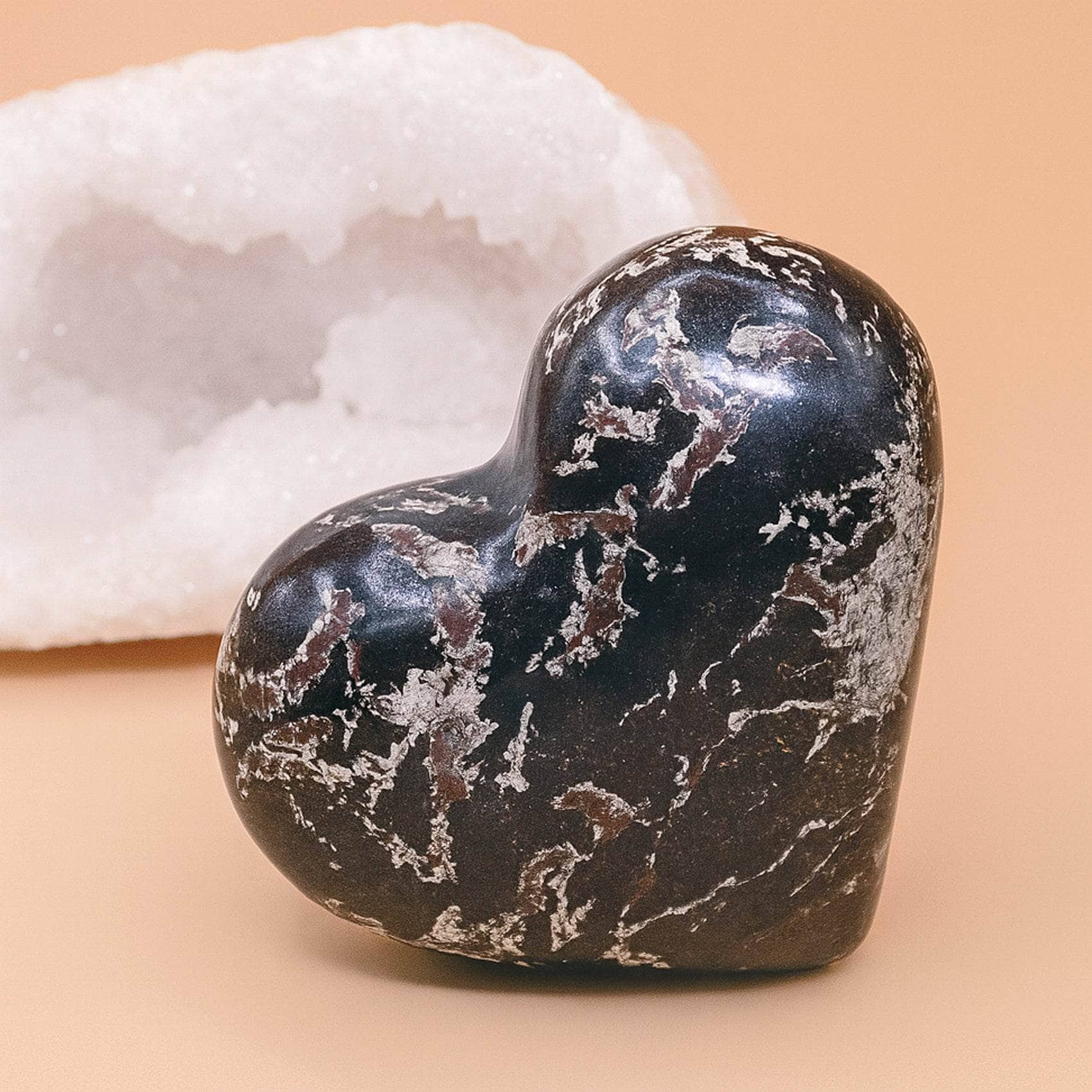 Close-up of Covellite heart showing mesmerizing metallic color shift
