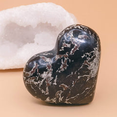 Close-up of Covellite heart showing mesmerizing metallic color shift