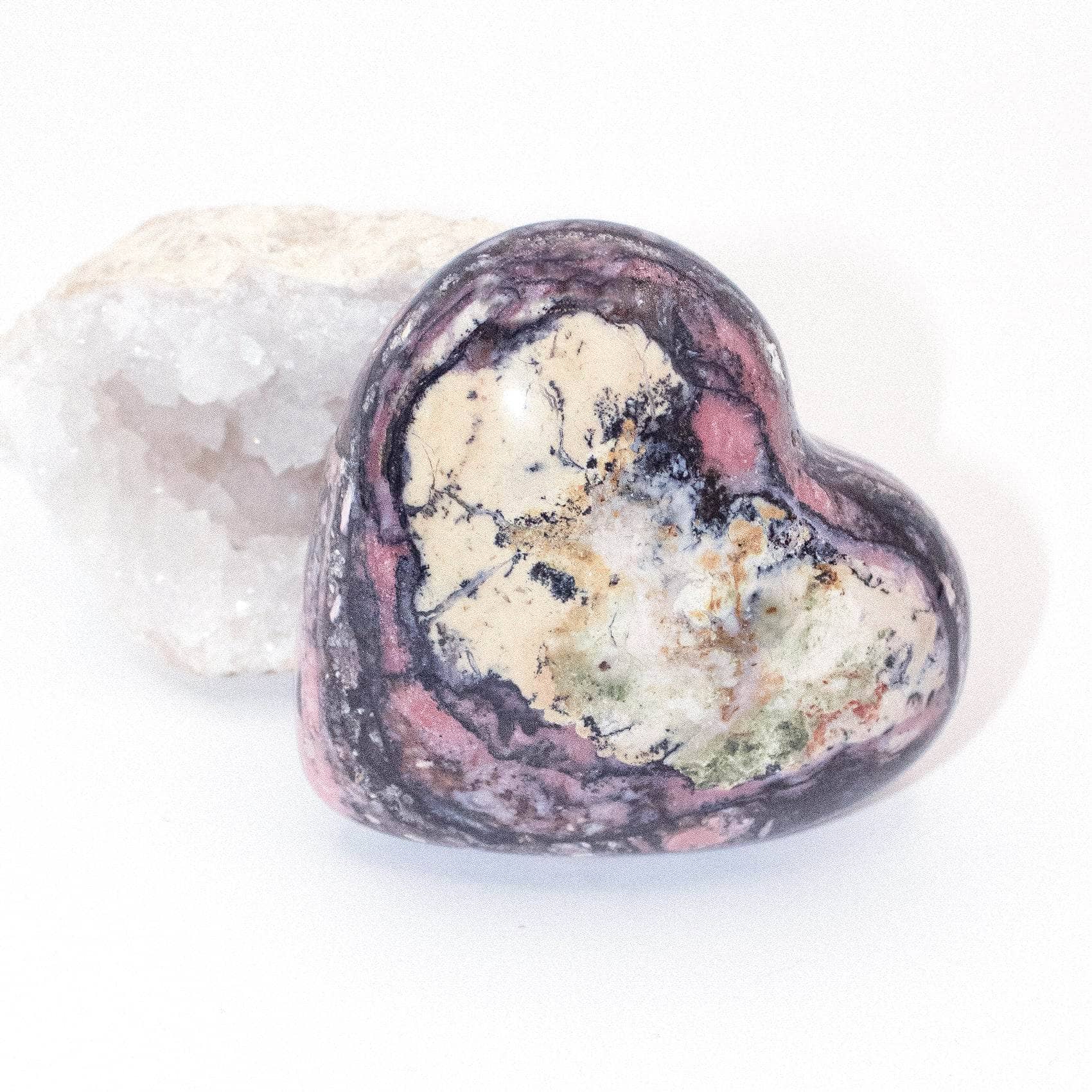 AAA Strawberry Opal heart on display with intricate details