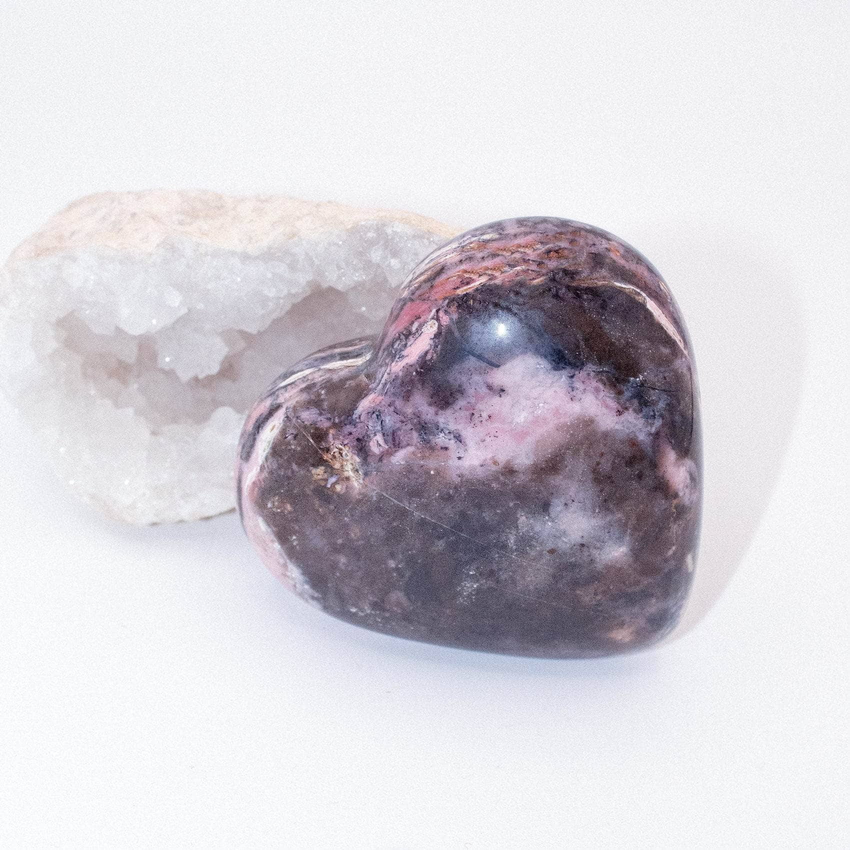 AAA Strawberry Opal heart on display with intricate details