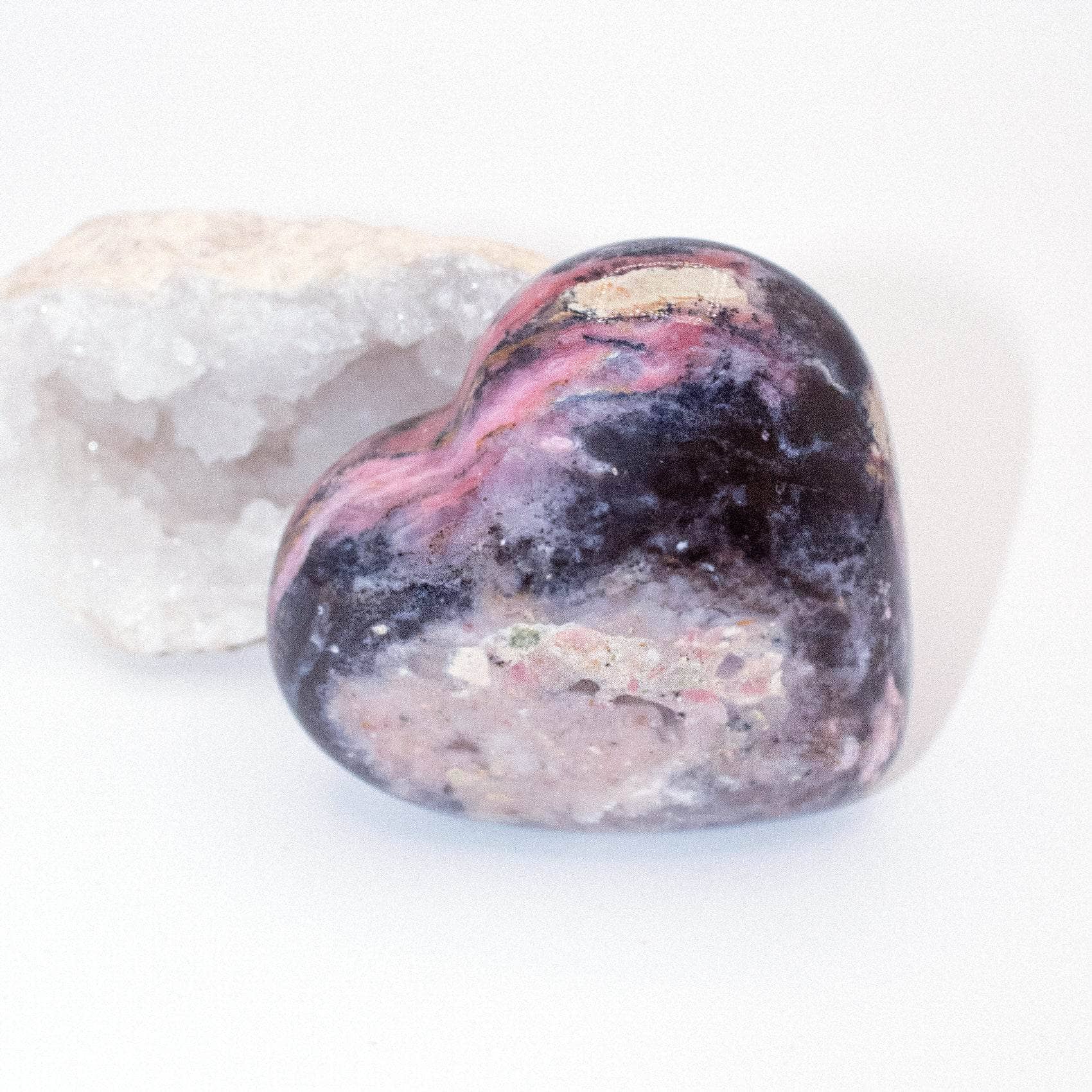 AAA Strawberry Opal heart on display with intricate details