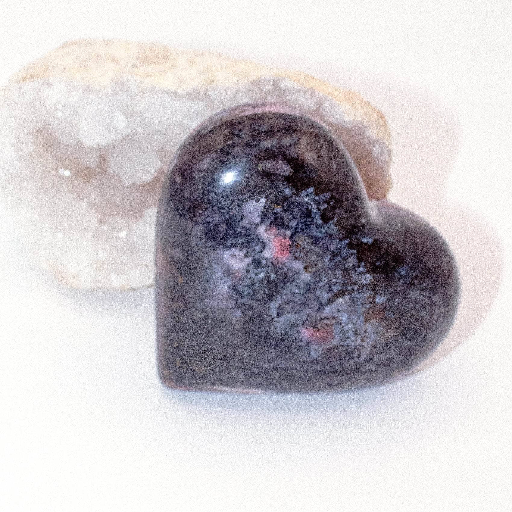 AAA Strawberry Opal heart on display with intricate details