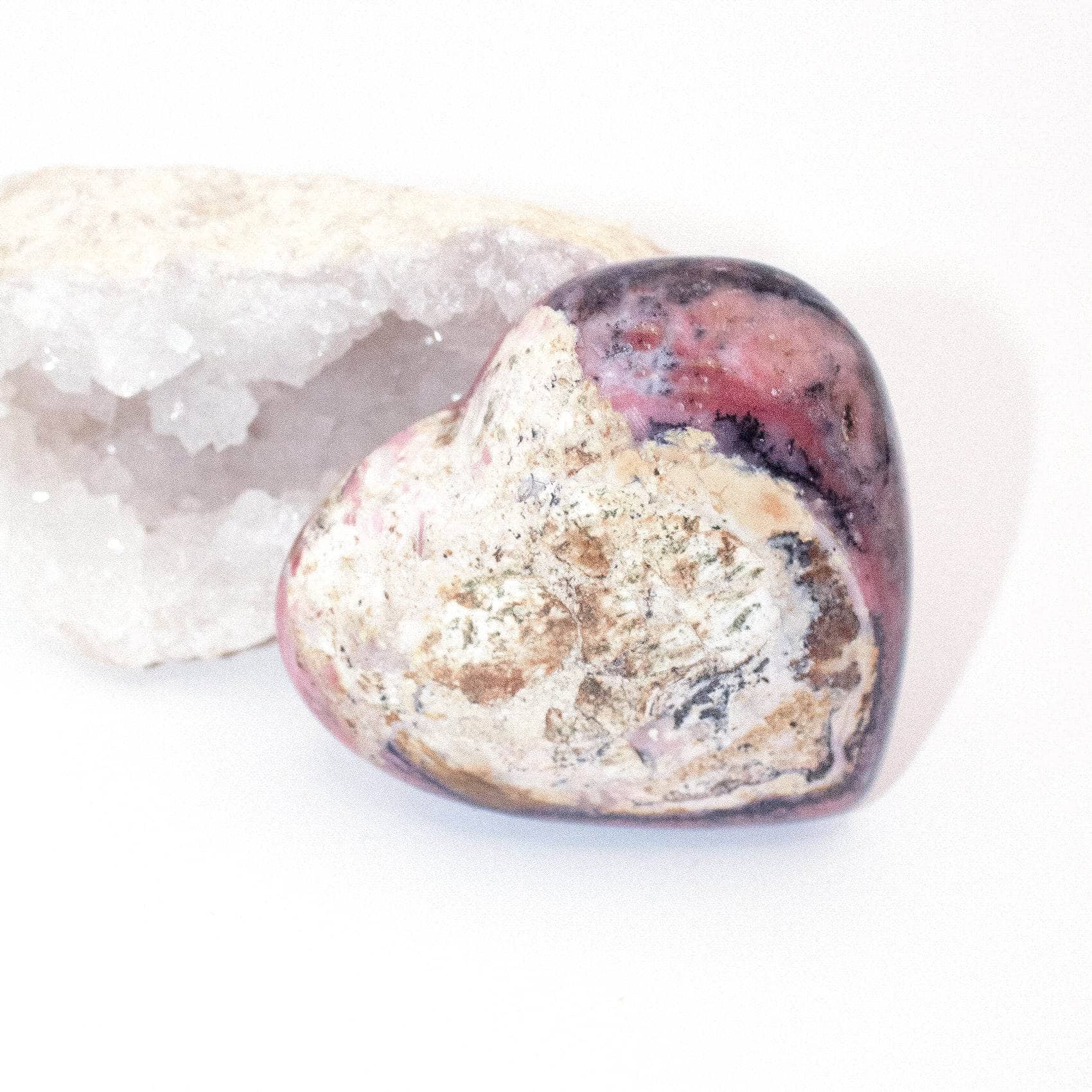 AAA Strawberry Opal heart on display with intricate details