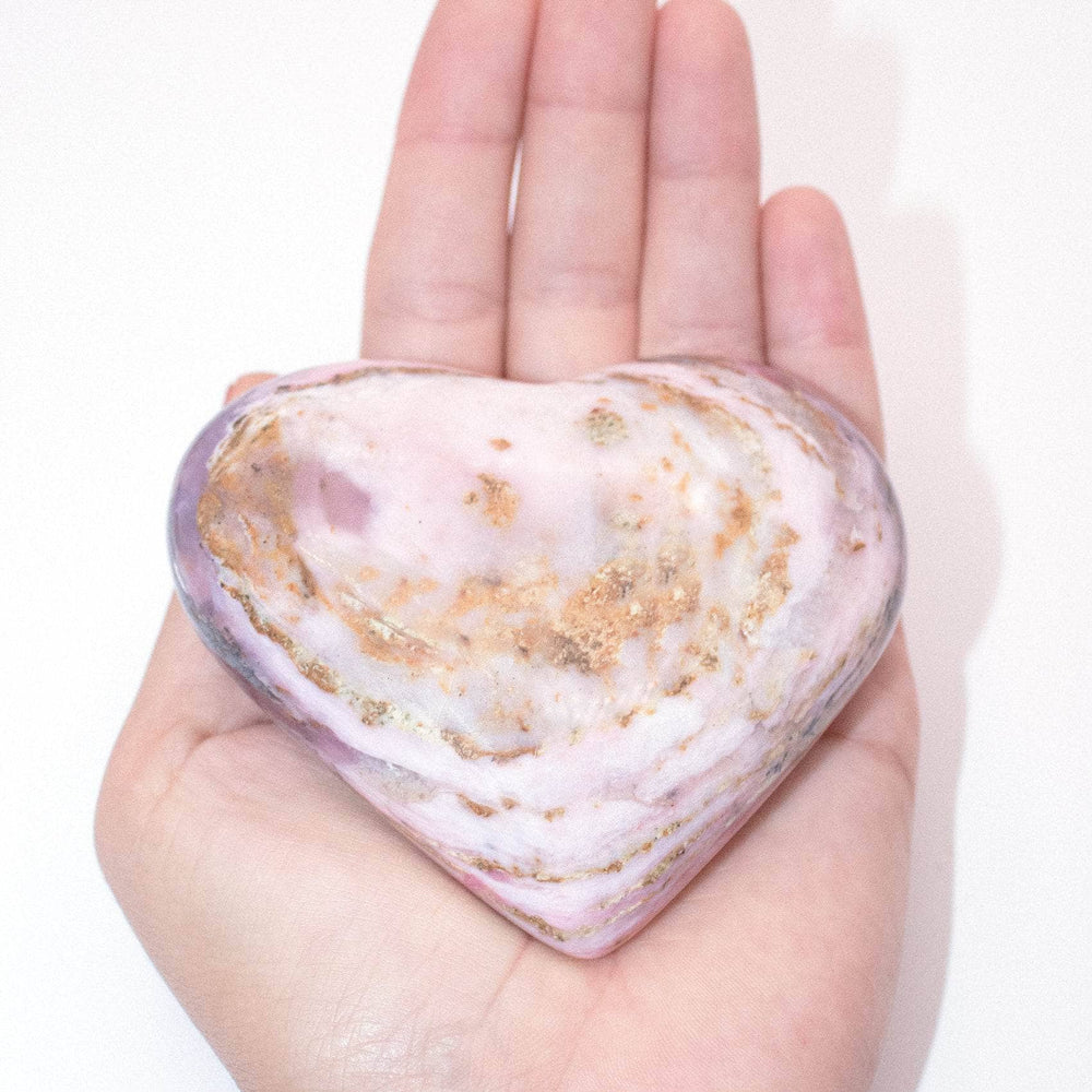 AAA Strawberry Opal heart on display with intricate details