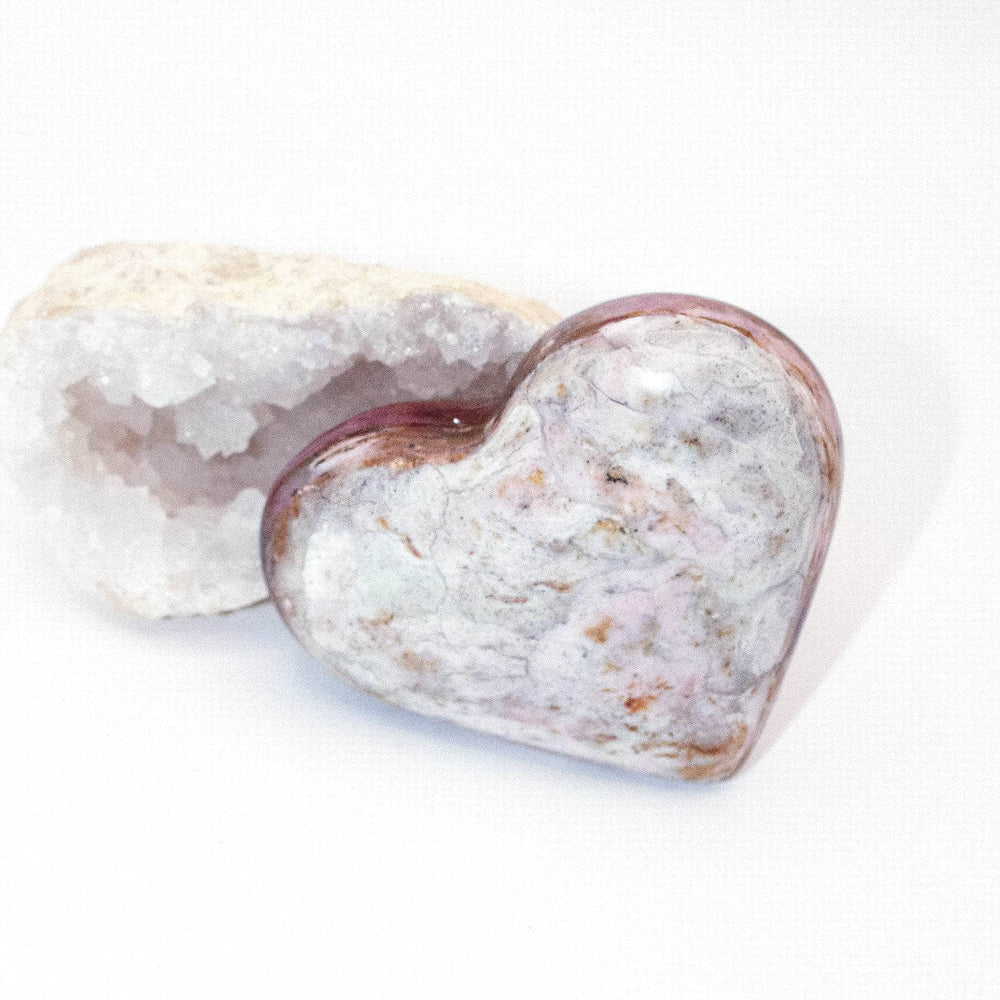 AAA Strawberry Opal heart on display with intricate details