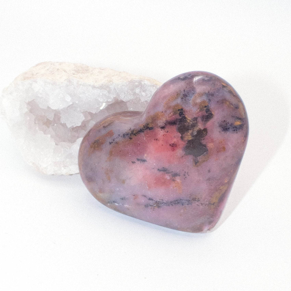 AAA Strawberry Opal heart on display with intricate details