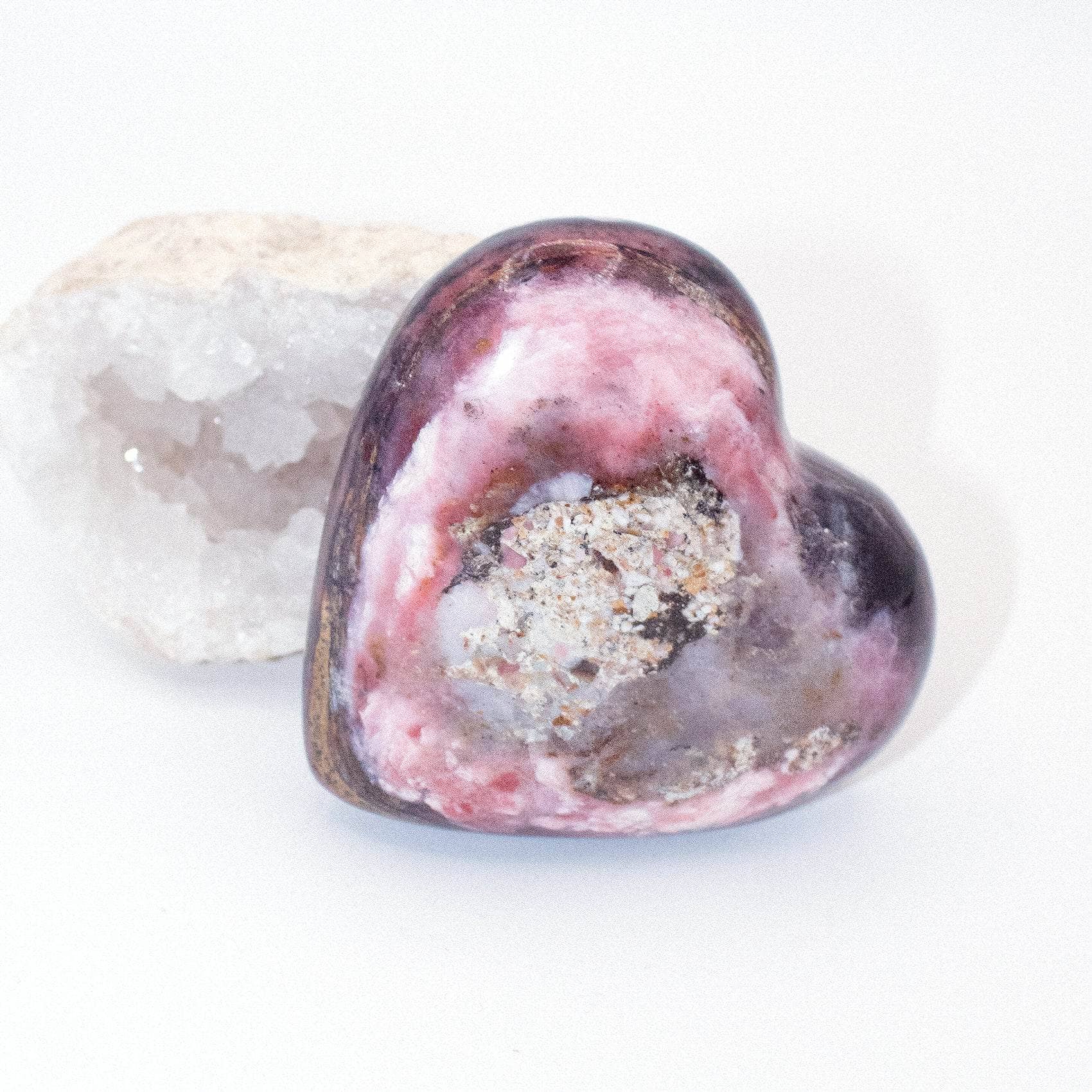 AAA Strawberry Opal heart on display with intricate details