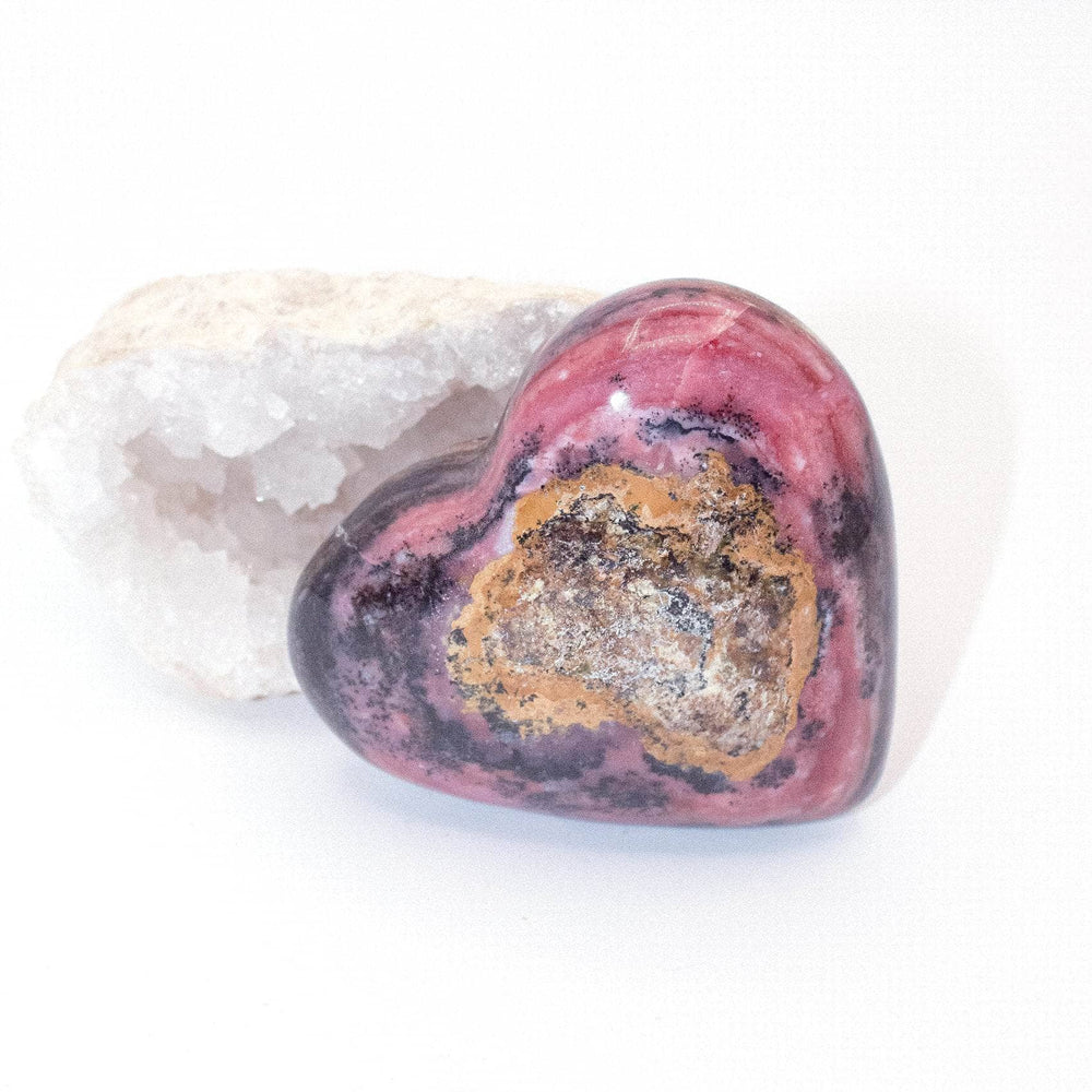 AAA Strawberry Opal heart on display with intricate details