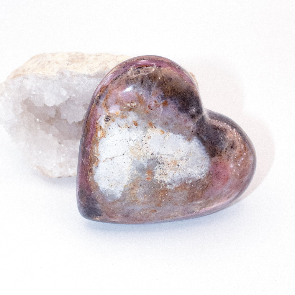 AAA Strawberry Opal heart on display with intricate details