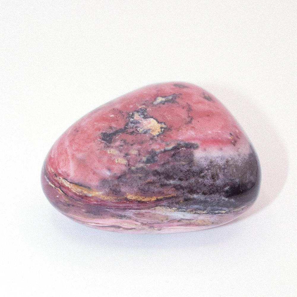 AAA Strawberry Opal palm stone on display with stunning details