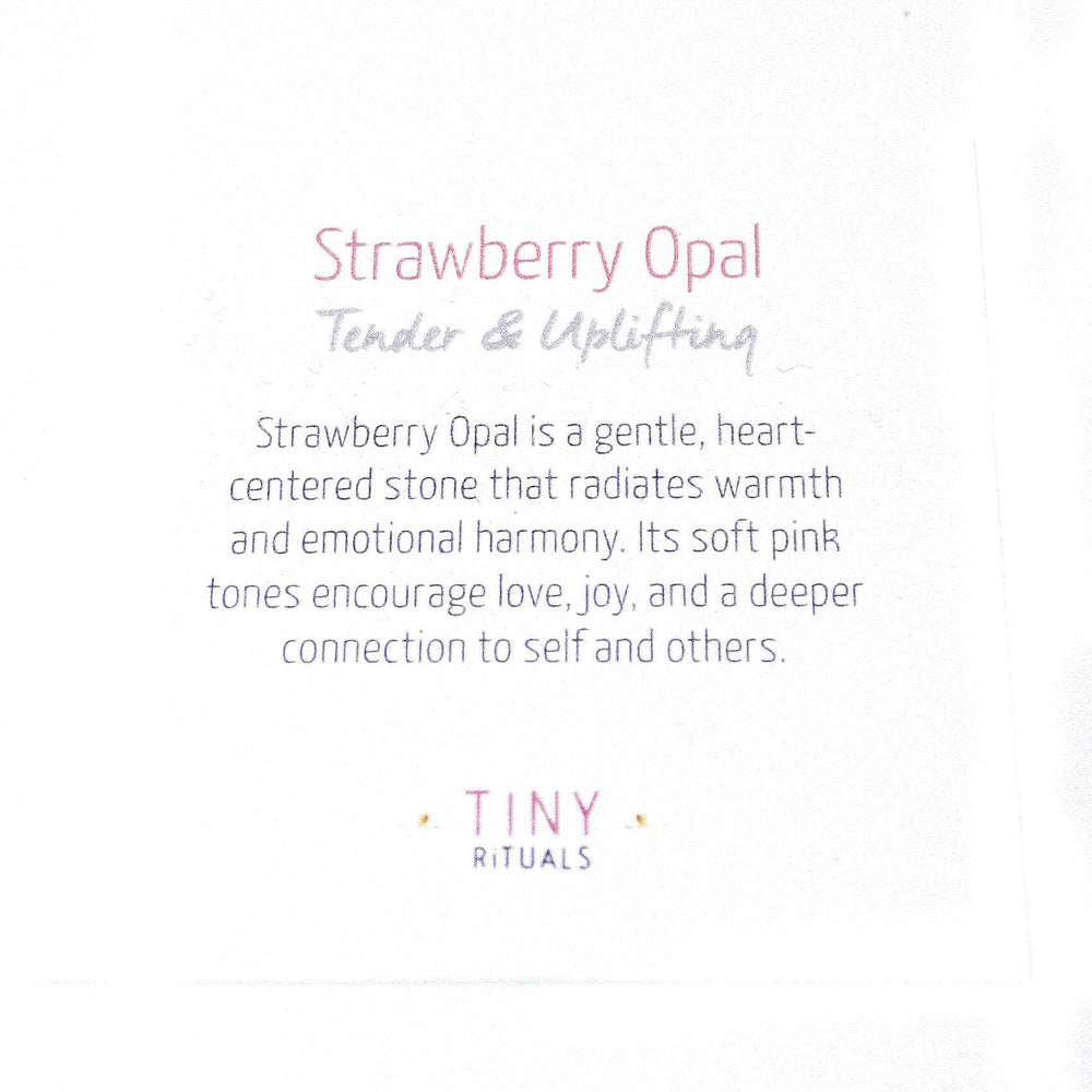 AAA Strawberry Opal palm stone on display with stunning details