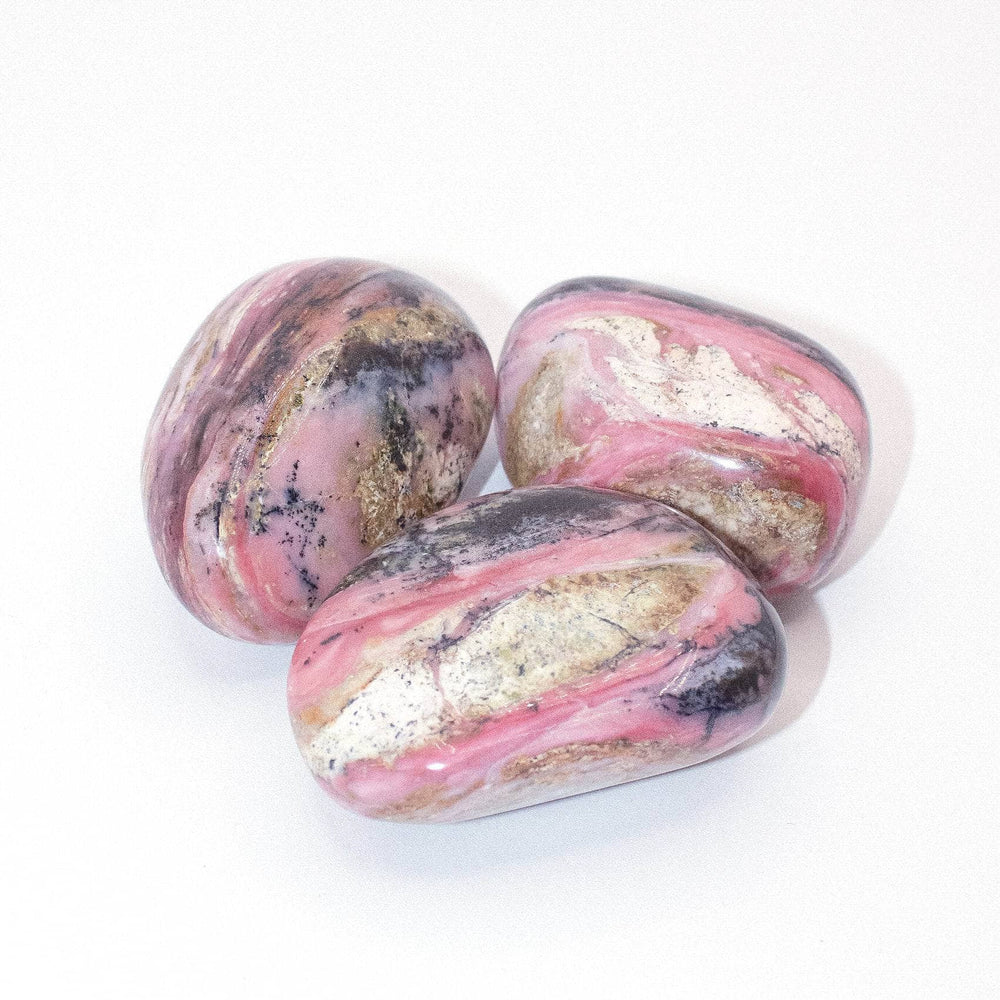 AAA Strawberry Opal palm stone on display with stunning details