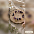 Natural amethyst crystal bracelet on white background, hand-strung 8mm Brazilian amethyst beads for wealth and spiritual calm, Crystalvana