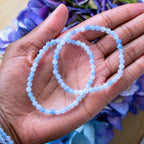 Aquamarine crystal bracelet stacked with other Crystalvana pieces