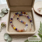 Black Gold Super Seven crystal necklace in gift box showing bead detail with golden rutile inclusions, Crystalvana