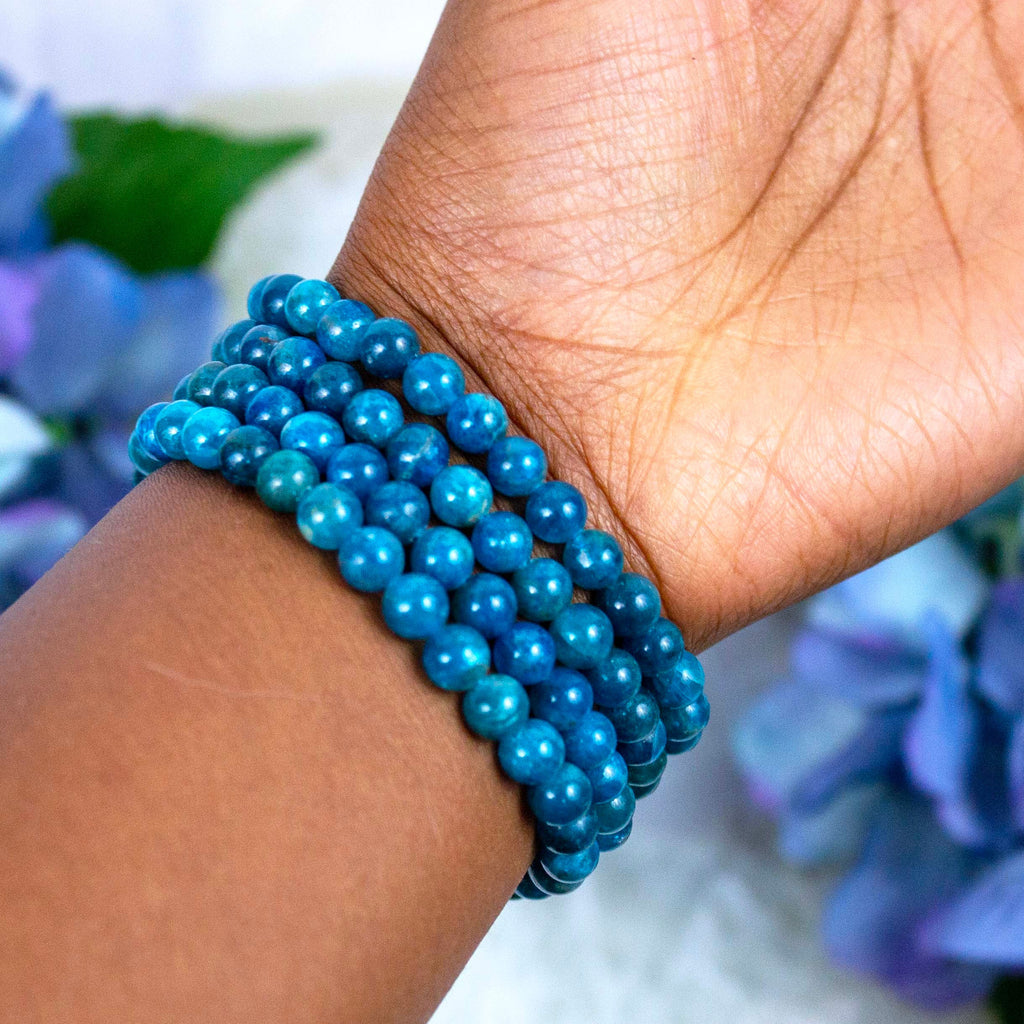 Blue Apatite crystal bracelet stacked with other Crystalvana pieces