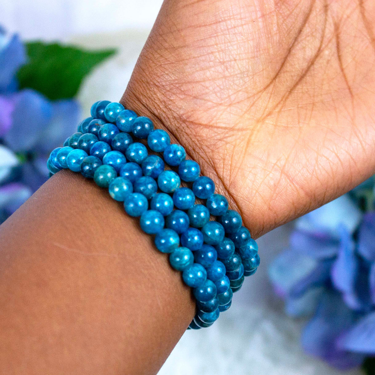 Blue Apatite crystal bracelet stacked with other Crystalvana pieces