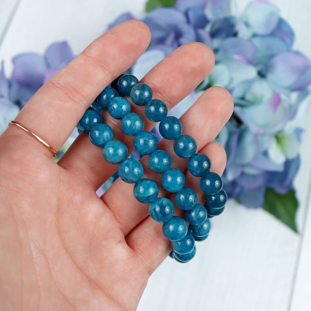 Blue Apatite bracelet held against the light