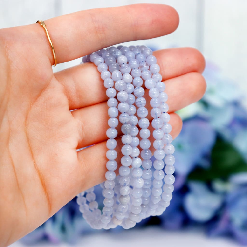 Close-up of natural Blue Lace Agate beads showing colour and pattern