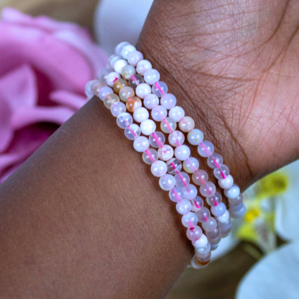 Flower Agate crystal bracelet stacked with other Crystalvana pieces