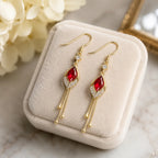 French design red crystal cat's eye drop earrings on pink cushion, Crystalvana