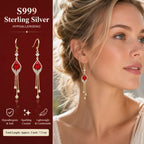 Model wearing French design red crystal cat's eye drop earrings blonde low bun ear close-up, Crystalvana