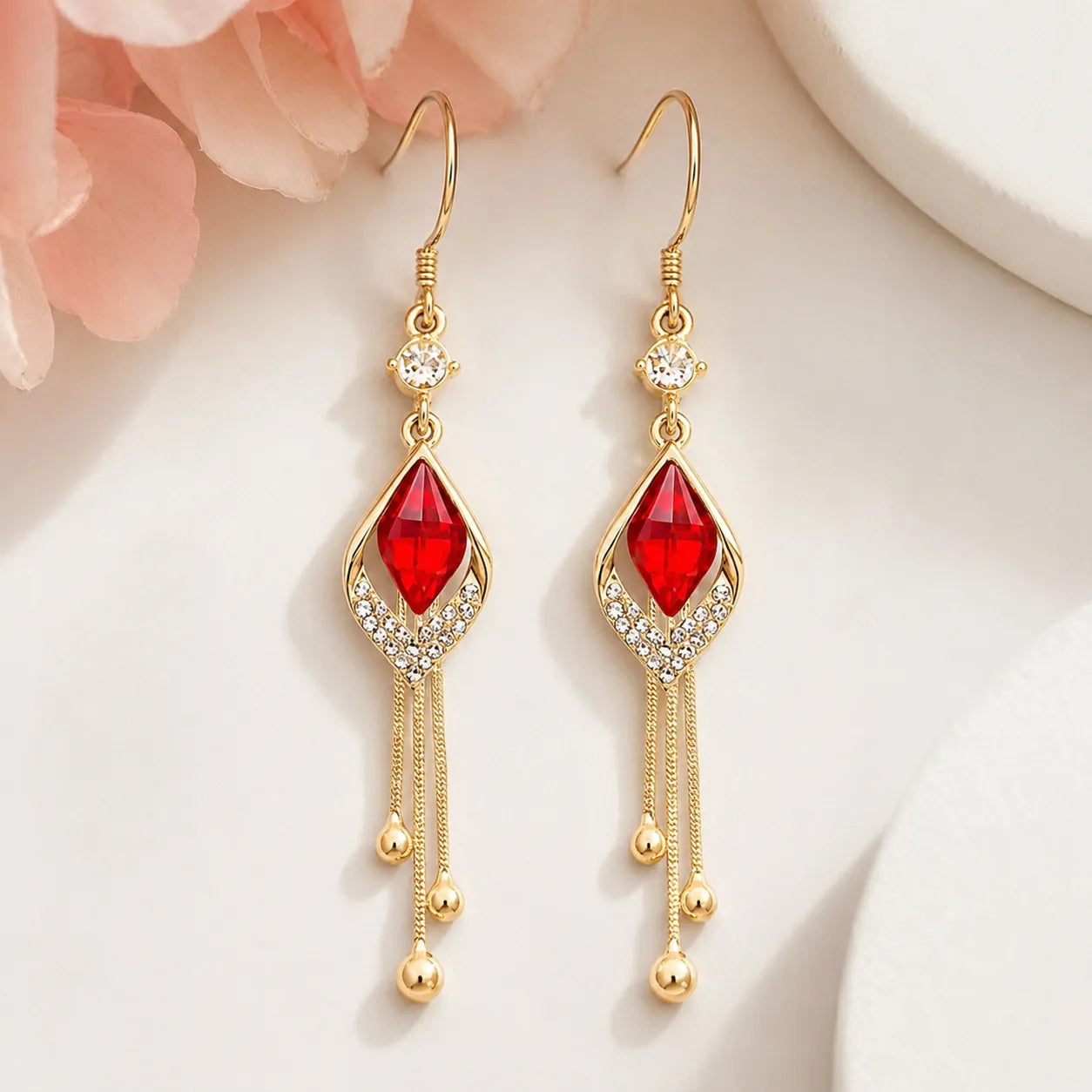 French design red crystal cat's eye drop earrings flat lay on beige velvet box, Crystalvana