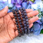 Close-up of natural Iolite beads showing colour and pattern