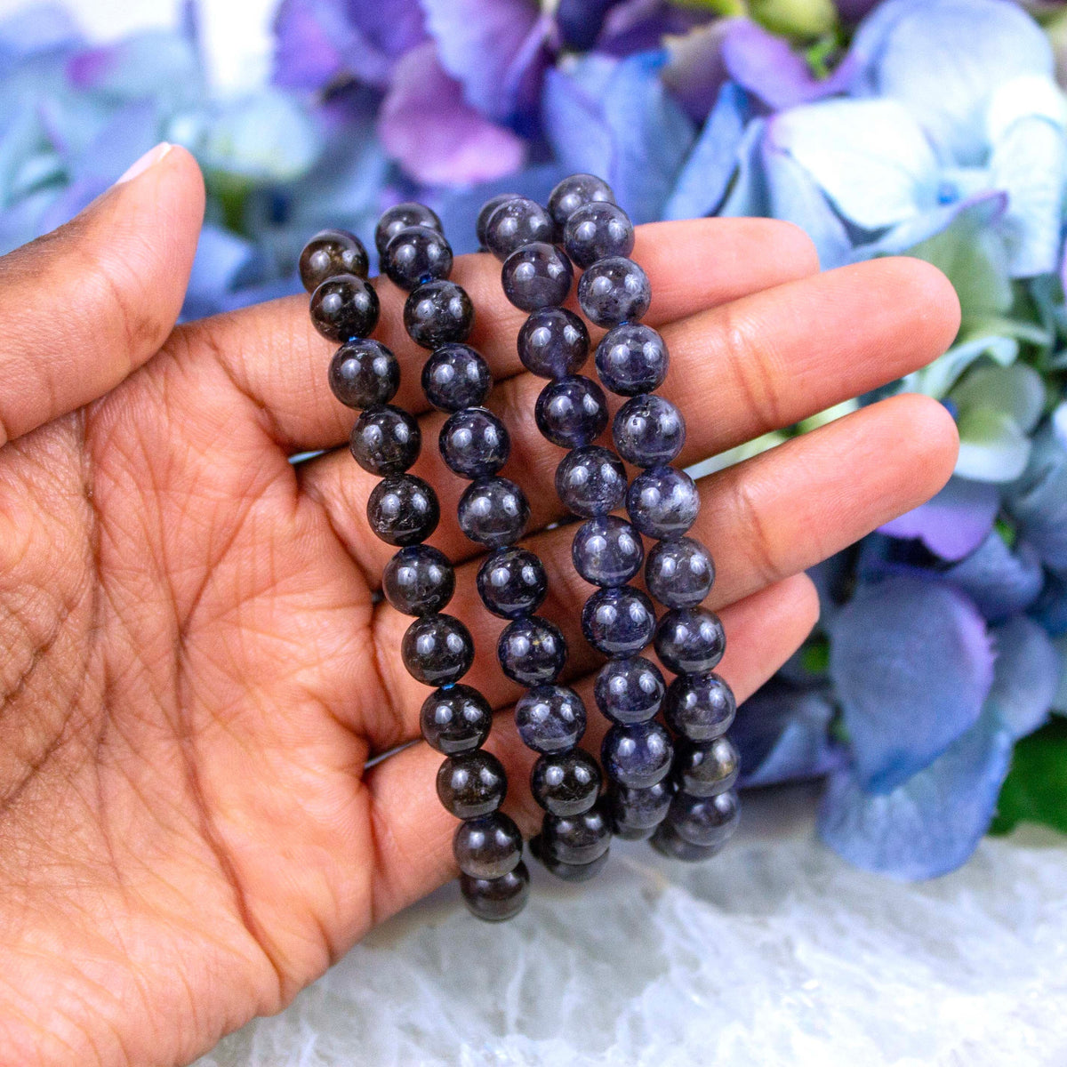 Close-up of natural Iolite beads showing colour and pattern