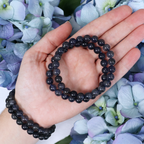 Iolite bracelet held against the light
