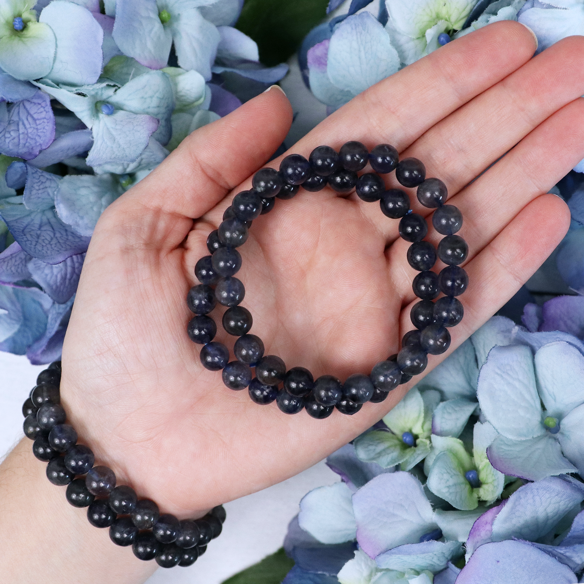 Iolite bracelet held against the light
