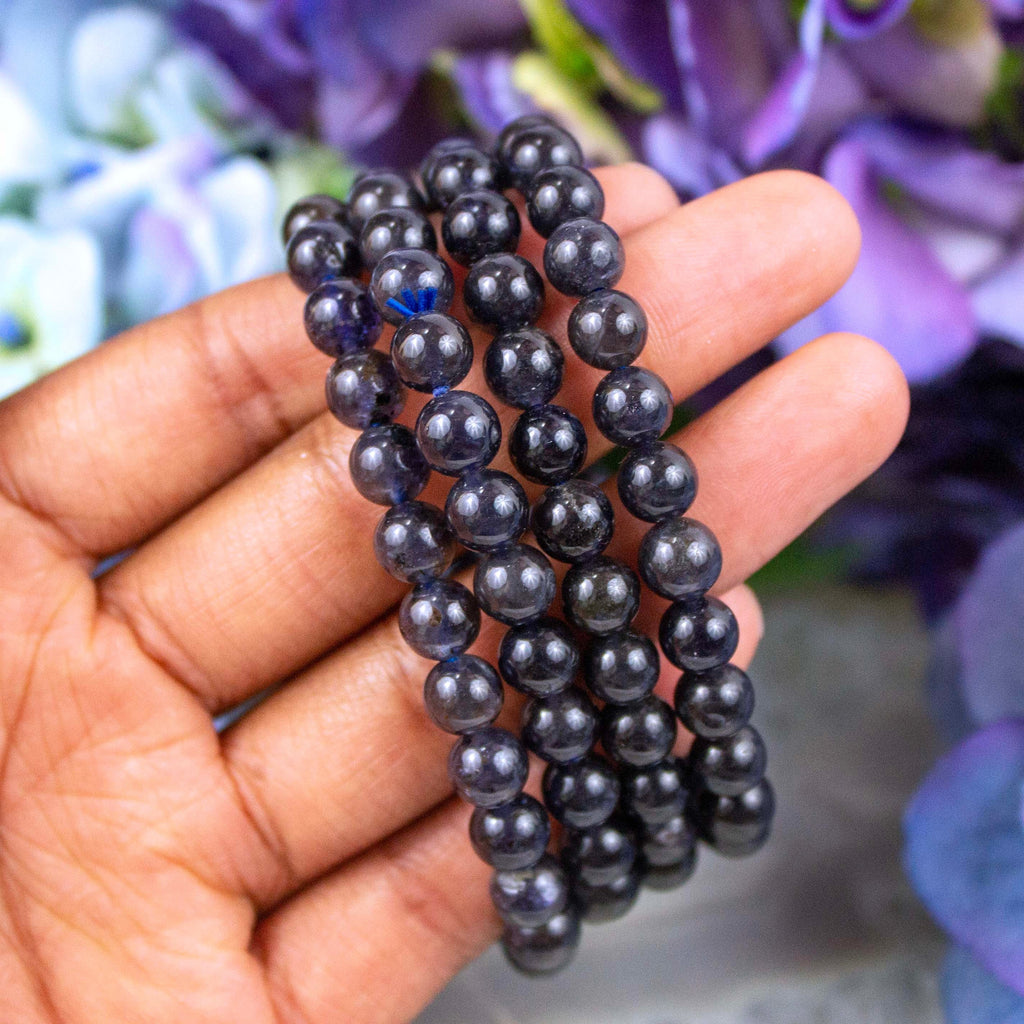 Iolite bracelet held against the light