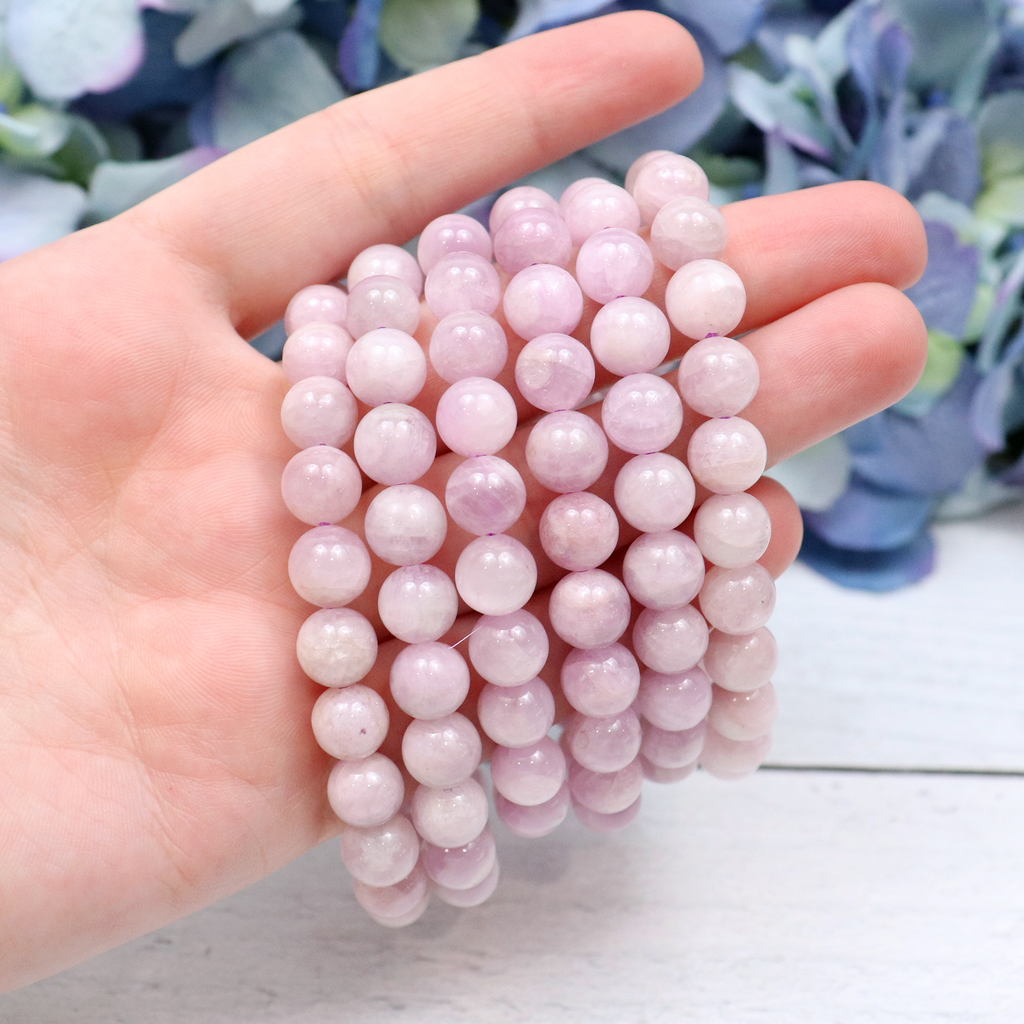 Close-up of natural Kunzite beads showing colour and pattern