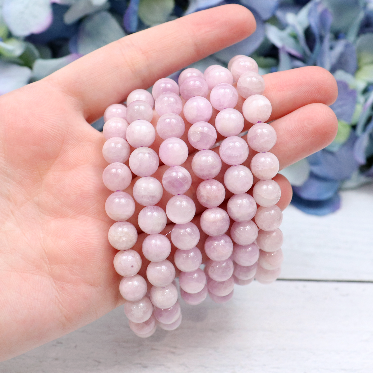 Close-up of natural Kunzite beads showing colour and pattern